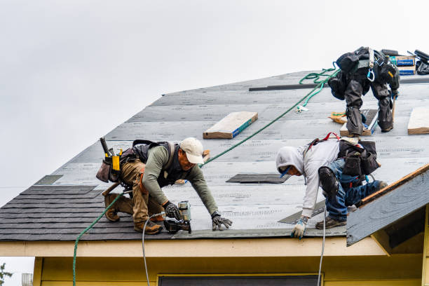 Professional Roofing technician working in Ayer, MA
